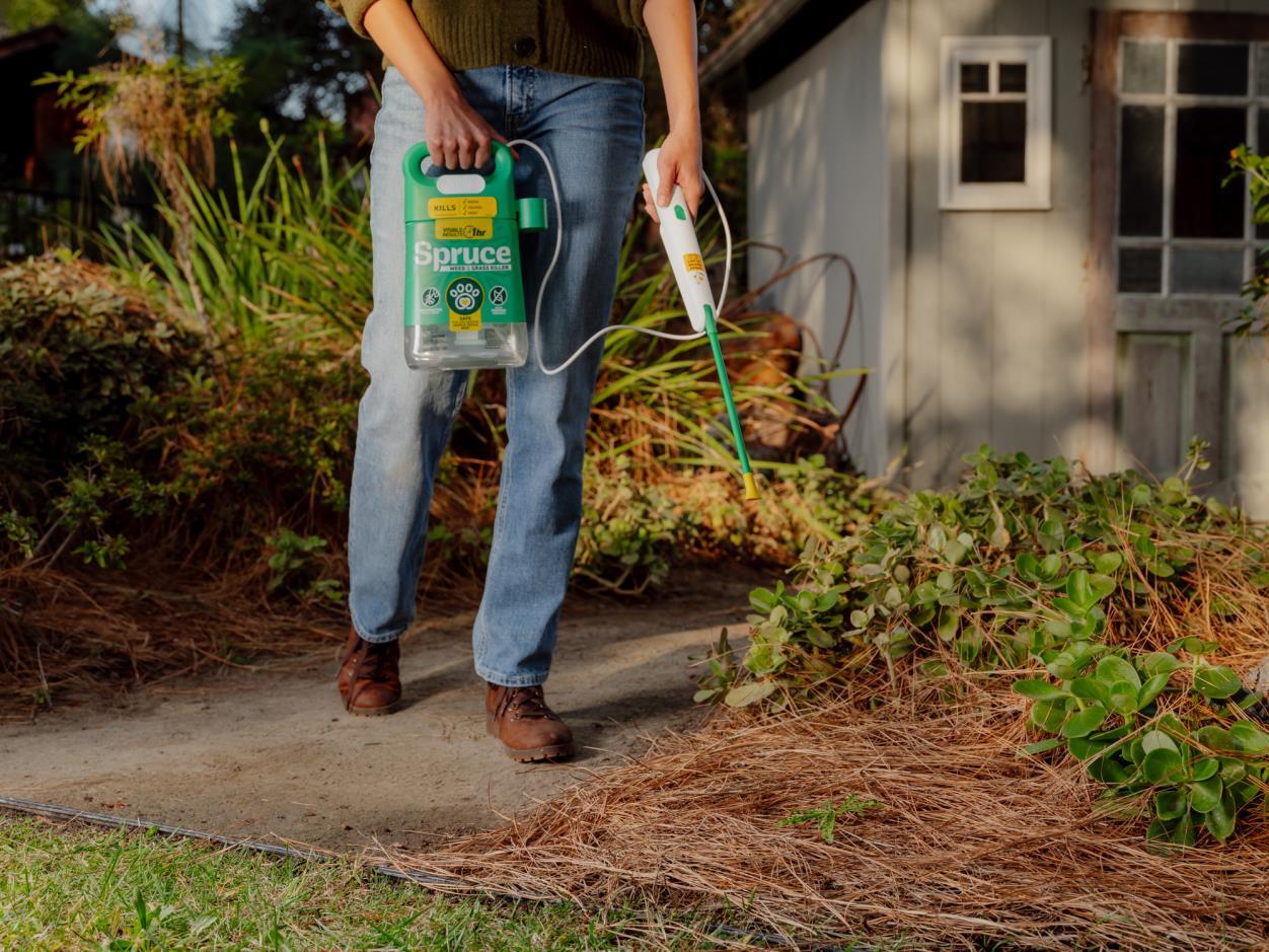 Spruce Weed & Grass killer Power Wand spray being used outside